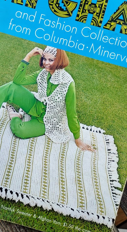C-M cover for Afghan and Fashion Collection. Photo of a woman in a green top and pants with a white filet dress and headband. She is sitting on a green and white afghan.
